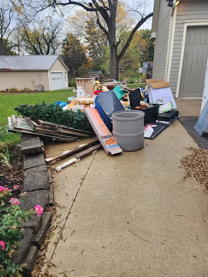 Dumpster being loaded with debris for 30 Yard Dumpster Rental in Fort Defiance